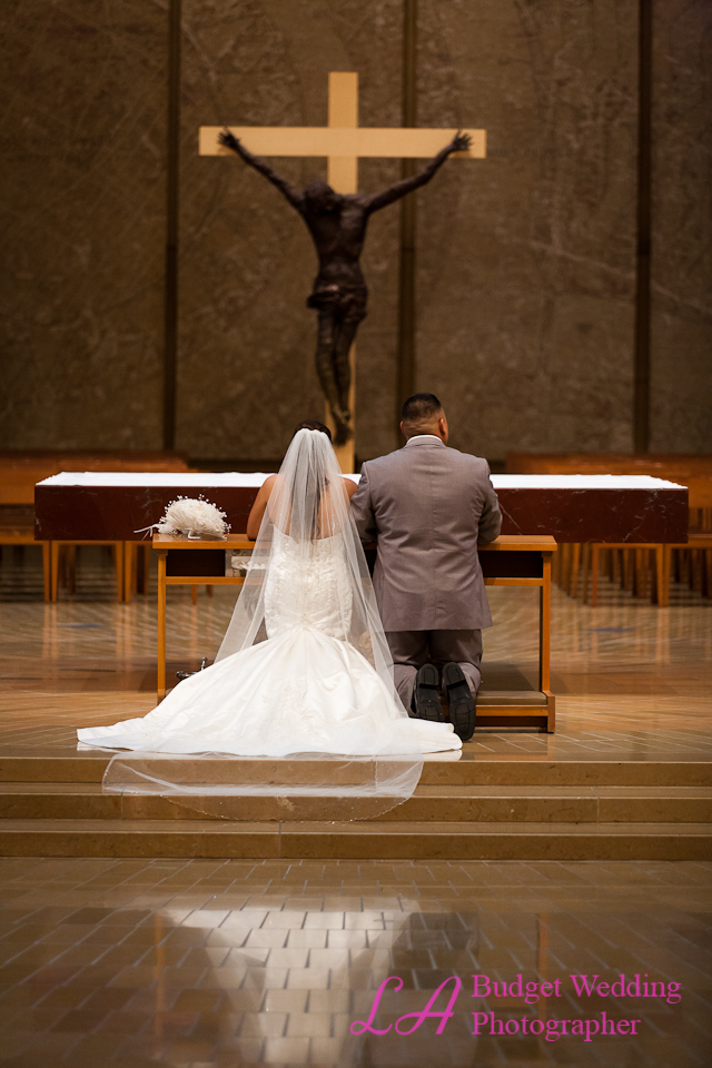 Couple kneeling at altar