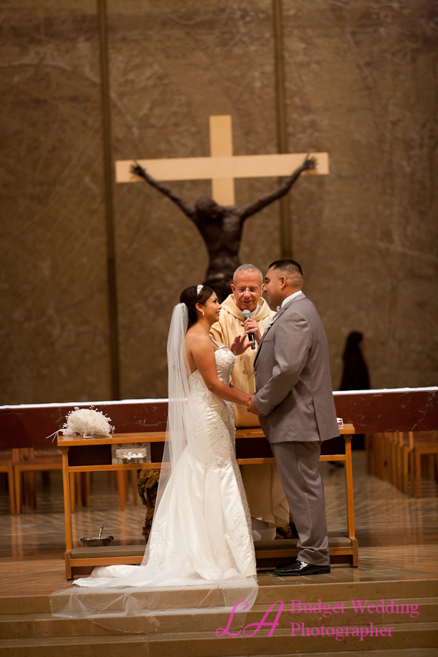 Couple reciting vows at altar
